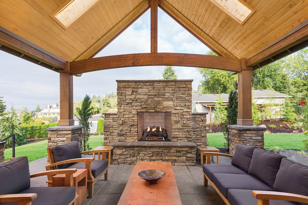 outdoor living space with pavilion and fireplace