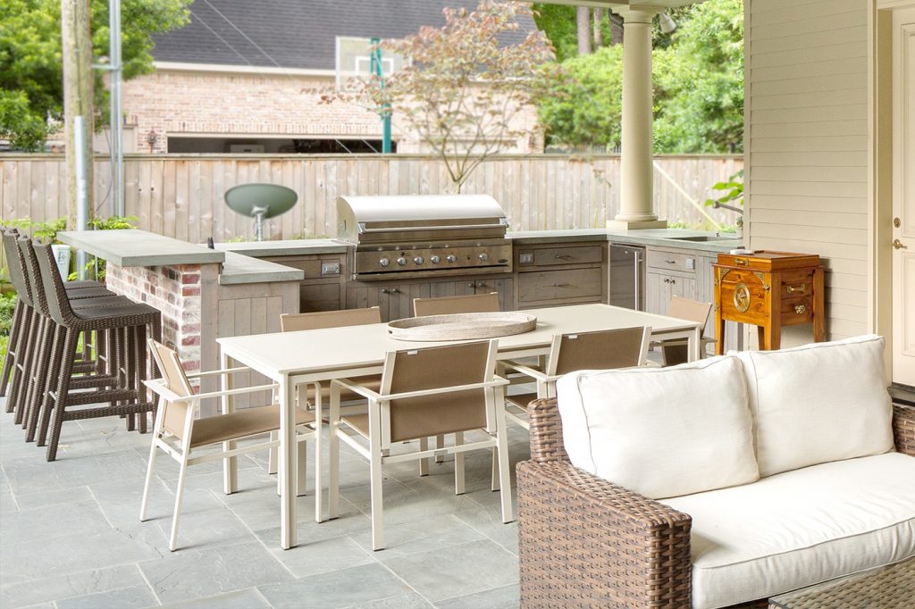 Outdoor kitchen spacec with diner and sofa area