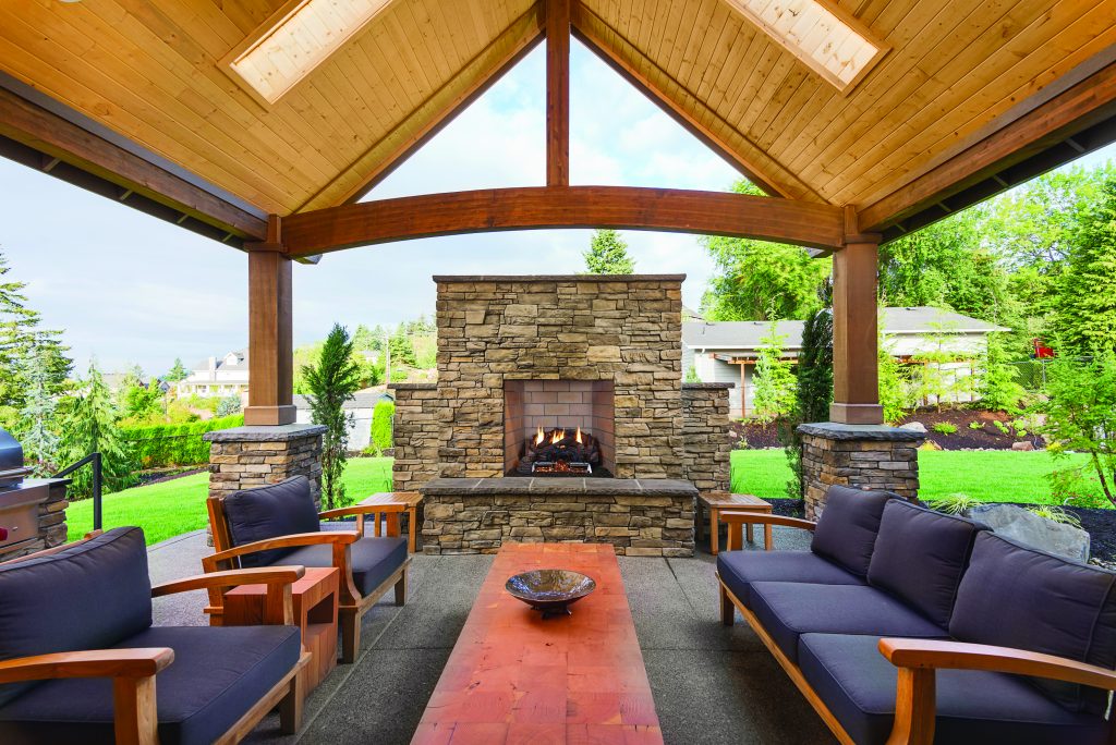 Outdoor space with pavilion and fireplace