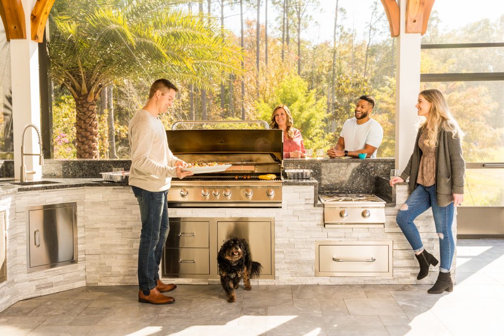 Friends cooking in an outdoor grill